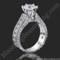 Standing side view of the channel set round diamond engagement ring with its tall 6 prong crown - nrd411e-1