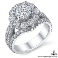 Triple Crown three row halo engagement ring, its round center lifted above a halo of larger diamonds - BBR-542
