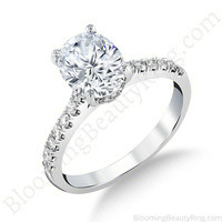 The Oval Embrace hidden halo diamond engagement ring on a white background, BBR742E
