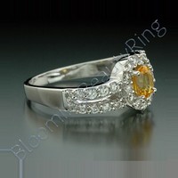 1.26 ctw. Oval Yellow Sapphire and Diamond Wave Ring - view 2