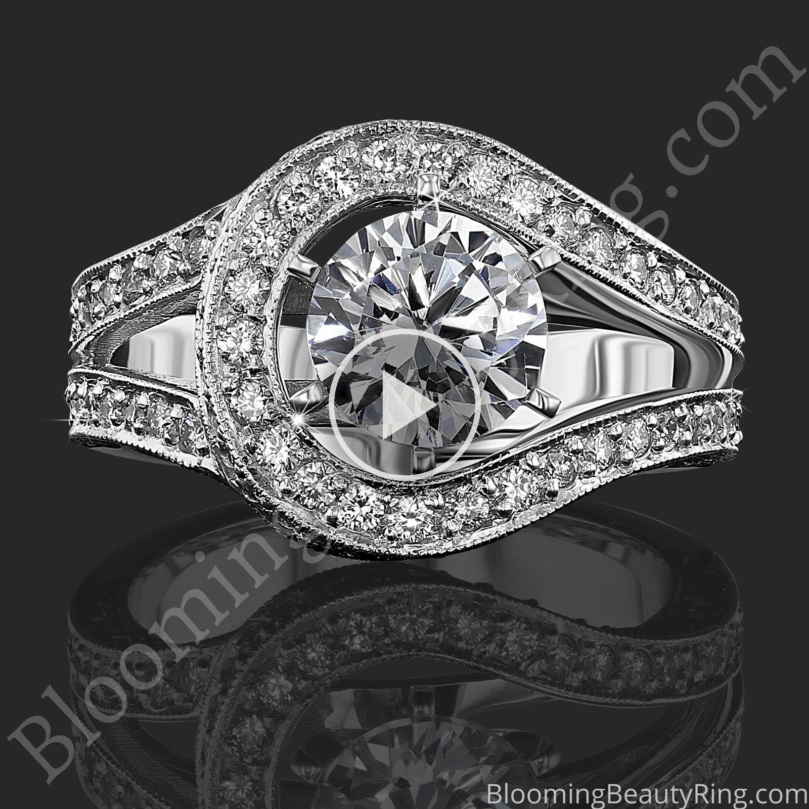 Play the video of the Swept Off Your Feet .92 ctw diamond engagement ring, laying down, rocking to show the round center diamond