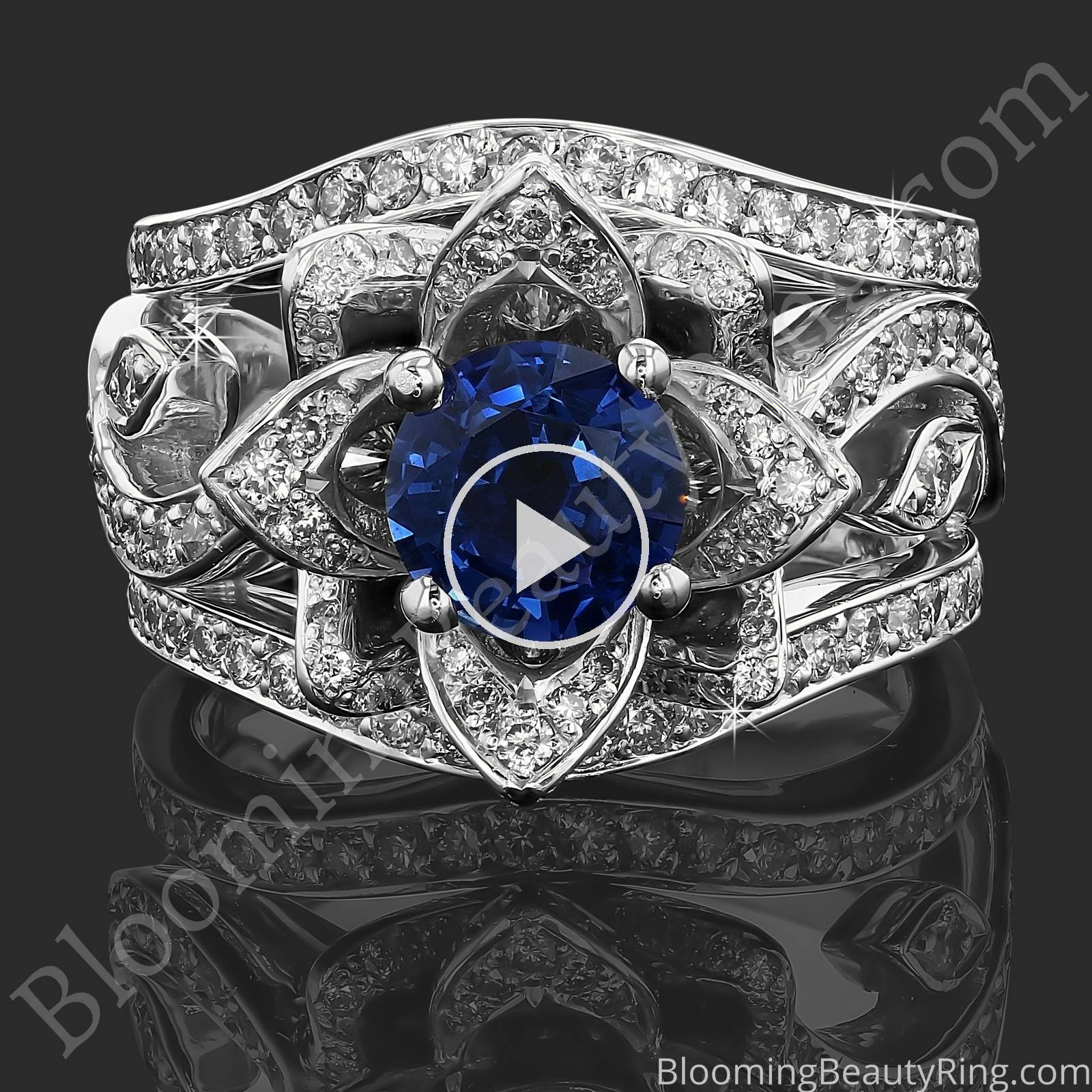 The Large Lotus Swan Double Band Flower Ring Set – bbr626-1 with a blue sapphire center laying down video