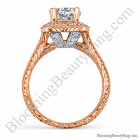 Side view of the two toned white and rose gold diamond halo engagement ring, showing the white gold V bridge and engraved rose gold band