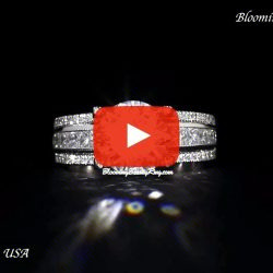Video of the diamond engagement ring laying down, pave diamonds running down a split band to the halo - BBR-705E