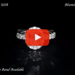 Video of the diamond engagement ring laying down, a halo of round diamonds over a pave set band - BBR727E