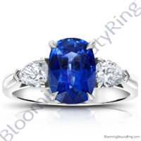 3.93 ctw. Cushion Blue Sapphire Ring with Pear Side Diamonds