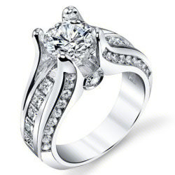 Round diamond engagement ring with channel set diamonds sweeping through a wide split band and a crossover head - bbr605E