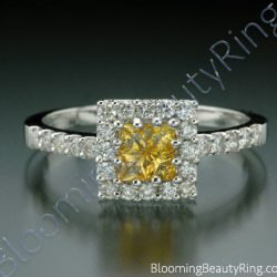 Yellow sapphire invisible set inside a square diamond halo on a slim pave set band - cgrRG190