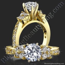 Round diamond engagement ring in yellow gold with a graduated four diamond cluster at each side and a tapered six prong head - bbr410