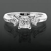 princess diamond engagement ring with sidestones to make the center diamond look larger