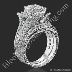 The small hand engraved blooming beauty flower ring and its matching engraved wedding band standing together - bbr434en-s-set