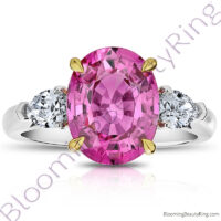 5.68 ctw. 3 Stone 2-Toned Oval Pink Sapphire Ring with Pear Side Diamonds